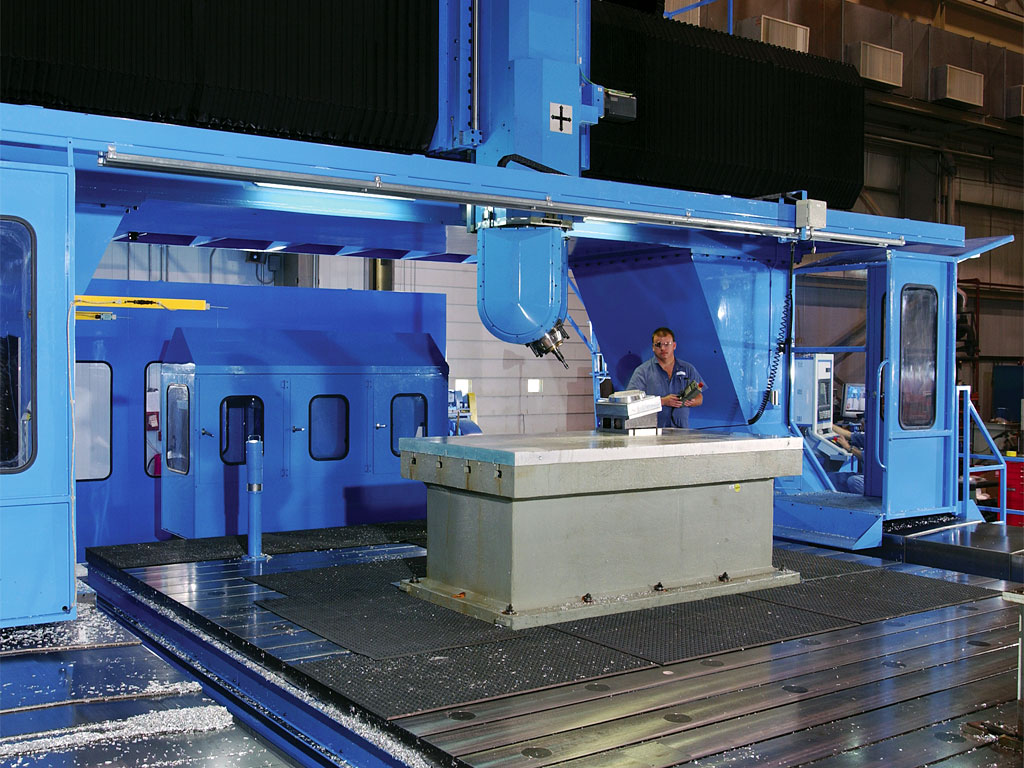 View of project engineer in lab with pieces of specialized equipment.