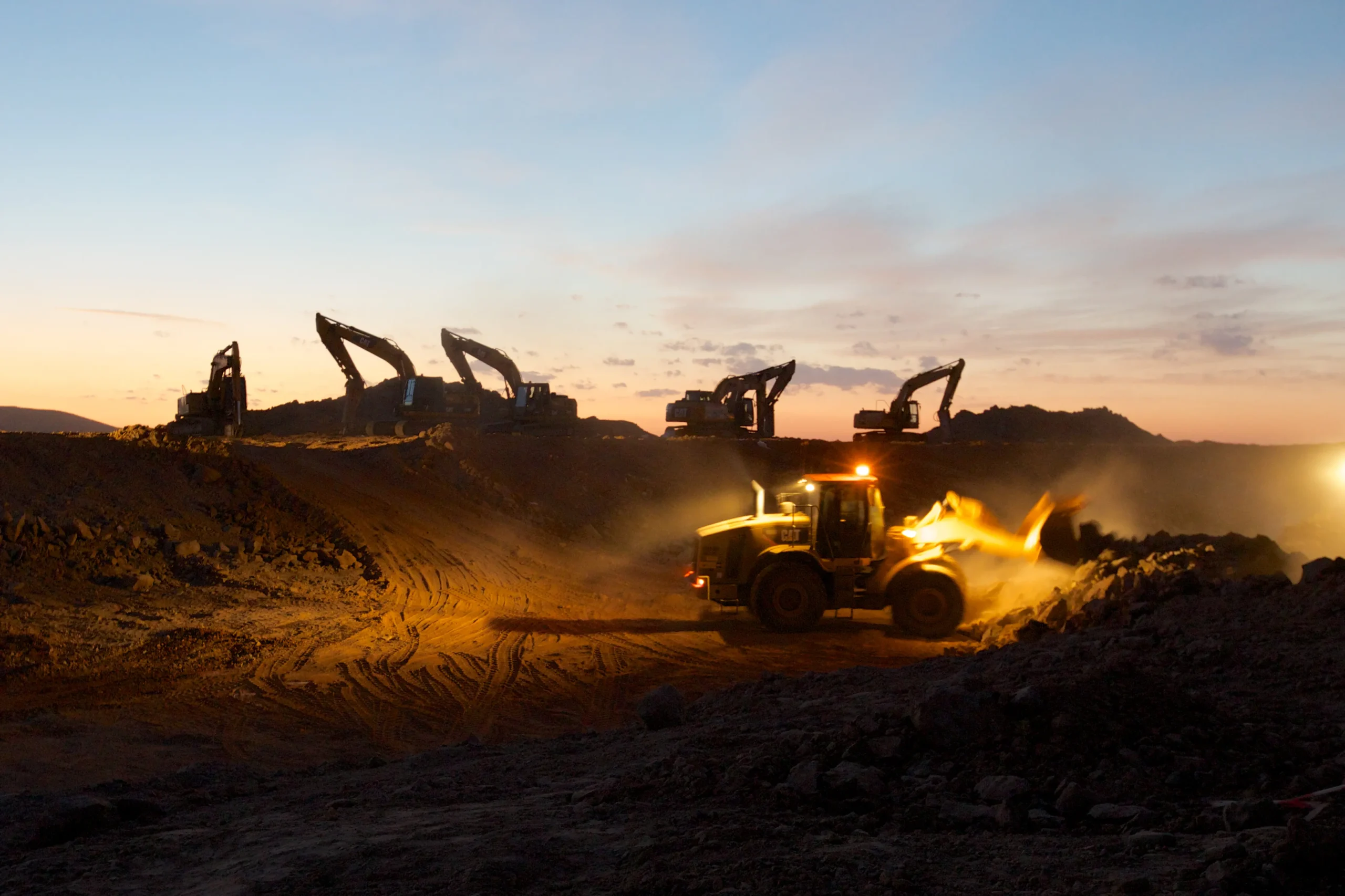 Waad Al Shamaal city development Night view of rock breaking and debris removal work at Road 12 West Cut 1.