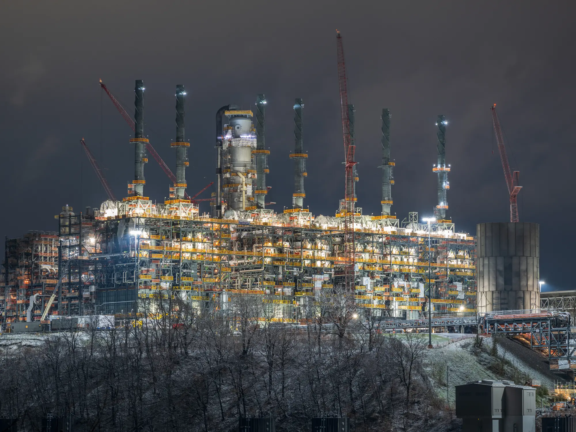 Professional artistic night photo of the Pennsylvania Chemicals site including ethane cracker unit (ECU) furnaces and quench tower.