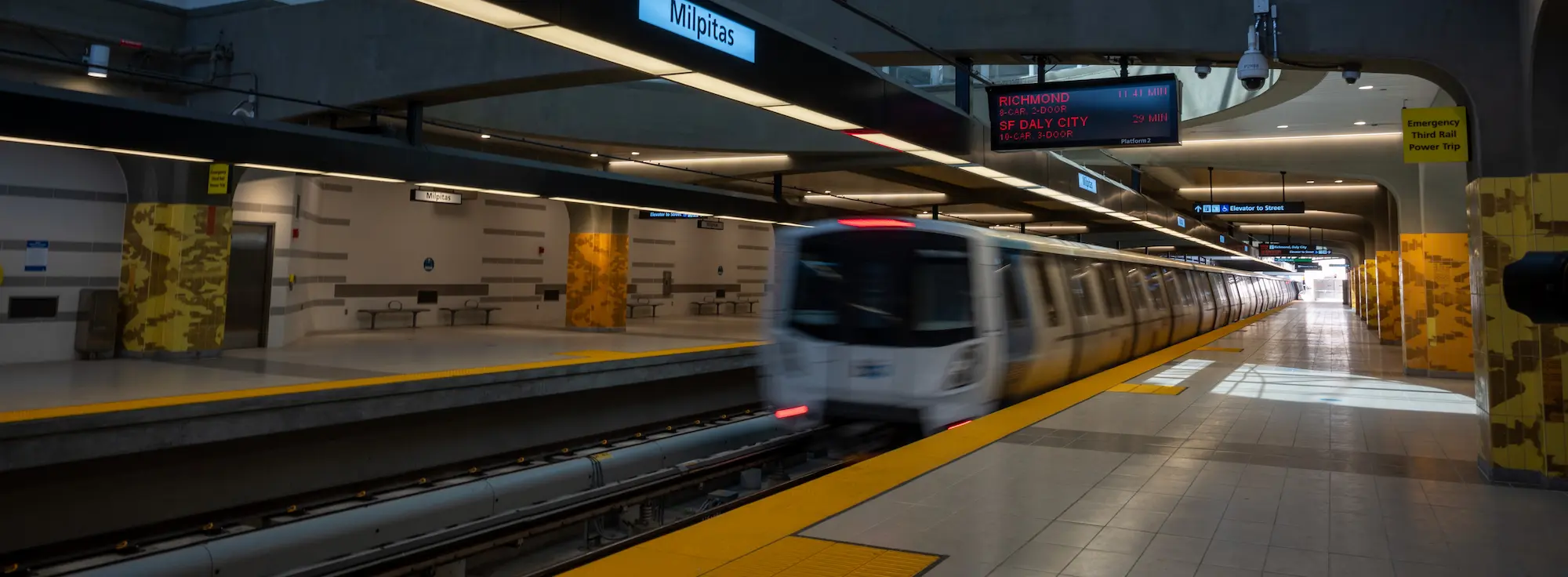 View of a Bay Area Rapid Transit train pulling into a station.